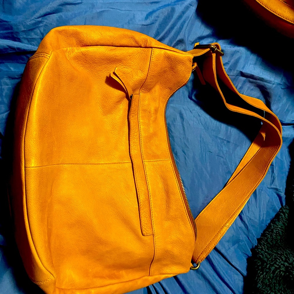This is a Vilentca hobo handbag
